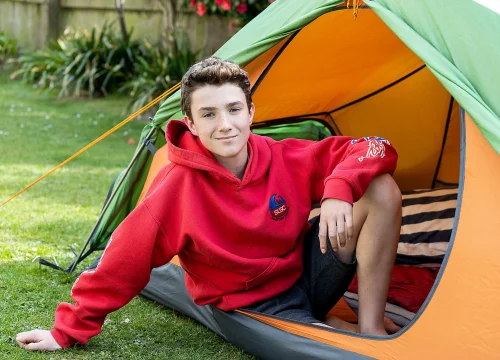 Max in a tent